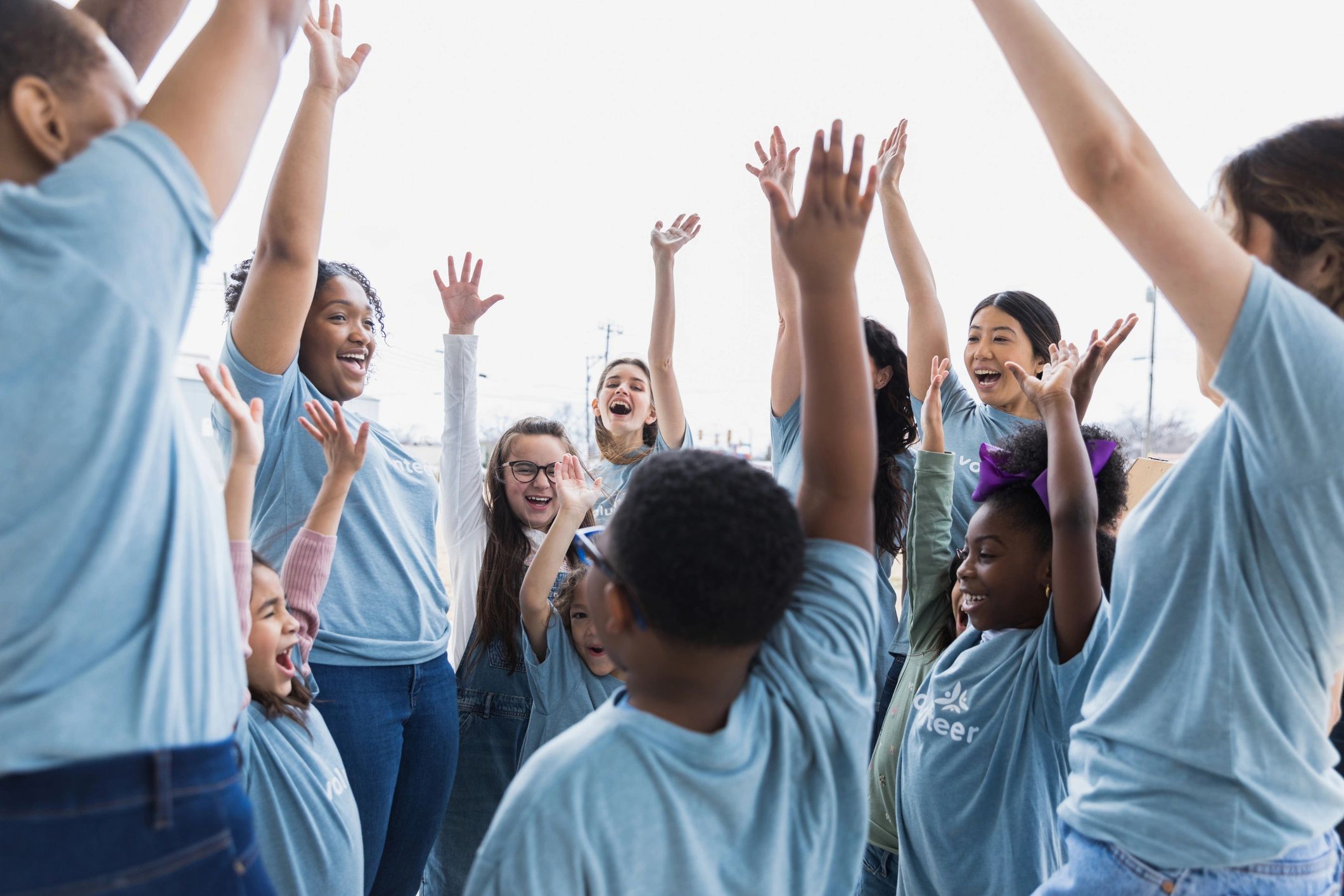 Volunteers celebrating together outdoors