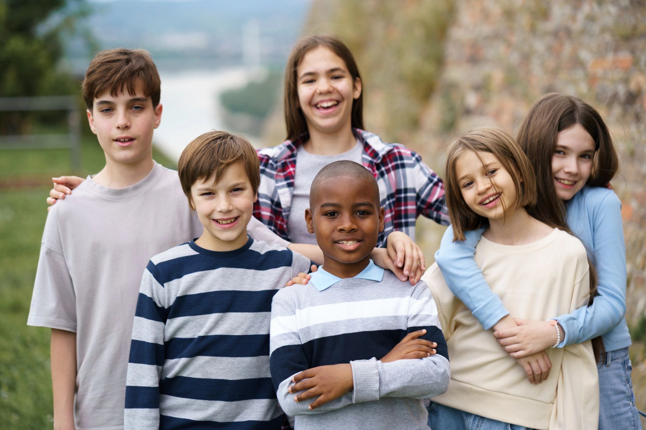 Young friends smiling together outdoors